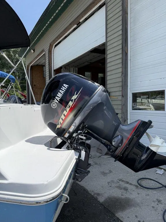Slide: The Image of 2025 Stingray 172SC boat with Yamaha VMAX outboard motor in a garage setting. - 34