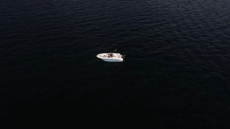 Slide: The Image of Aerial view of 2025 Stingray 172SC boat on dark ocean waters. - 5