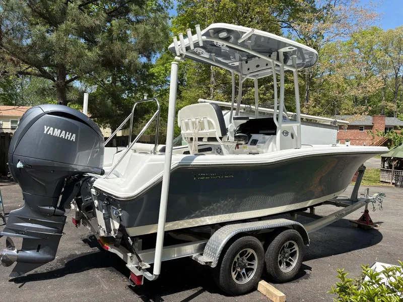Slide: The Image of 2023 Tidewater 210 CC Adventure boat with Yamaha engine on a trailer. - 2