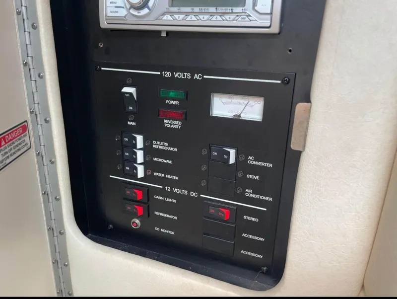 Slide: The Image of Electrical control panel on a 2001 Sea Ray 260 Sundancer boat. - 4