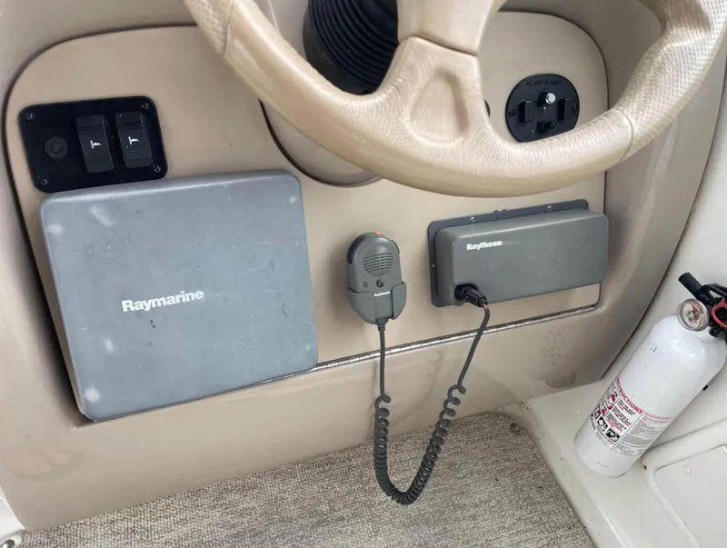 Slide: The Image of Control panel of a 2001 Sea Ray 260 Sundancer with Raymarine and Raytheon equipment. - 5