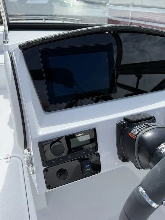 Slide: The Image of 2025 Stingray 231DC dashboard with touchscreen and control panel. - 24