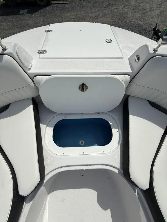 Slide: The Image of 2025 Stingray 231DC boat interior with seating and storage compartments. - 34