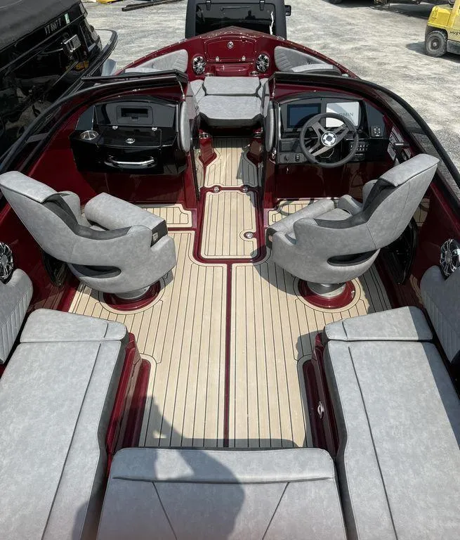 Slide: The Image of 2025 Stingray 23 OSX boat interior with modern seating and sleek dashboard design. - 17