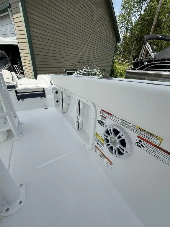 Slide: The Image of 2025 Stingray 216CC boat interior with speaker and storage compartments. - 10