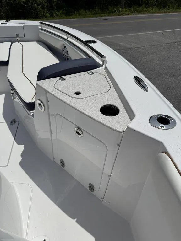 Slide: The Image of 2025 Stingray 216CC boat interior with seating and storage compartments. - 28