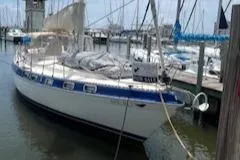 Slide: The Image of 1987 Morgan Catalina Morgan 41 Classic sailboat docked, for sale sign visible. - 2