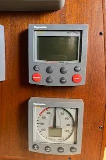 Slide: The Image of Interior of 1987 Morgan Catalina Morgan 41 Classic yacht with wooden cabinetry and blue seating. - 26