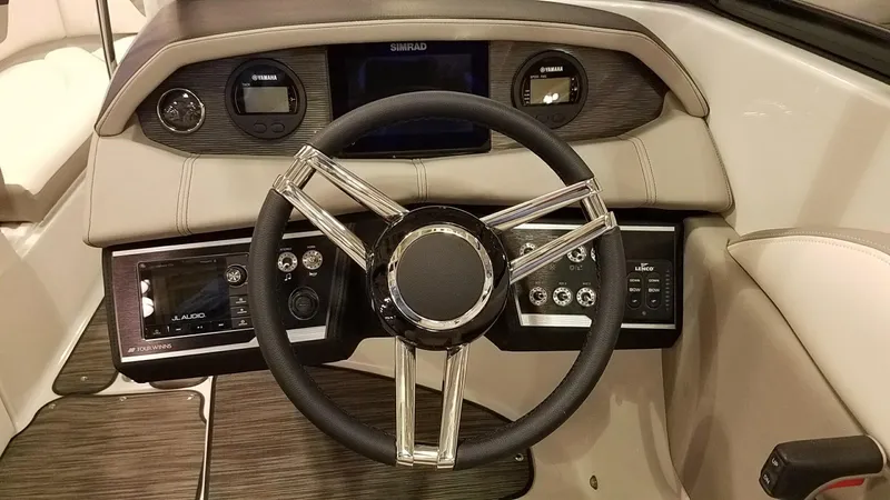 Slide: The Image of Steering wheel and dashboard of 2018 Four Winns HD270 OB boat. - 12