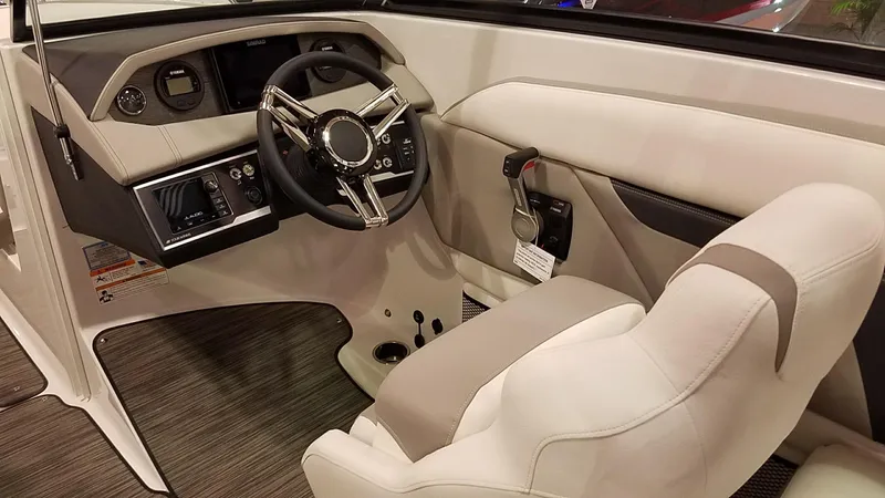 Slide: The Image of 2018 Four Winns HD270 OB boat interior with steering wheel and dashboard controls. - 14