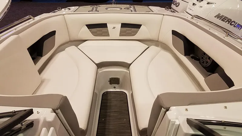 Slide: The Image of 2018 Four Winns HD270 OB boat interior with white cushioned seating and sleek design. - 5