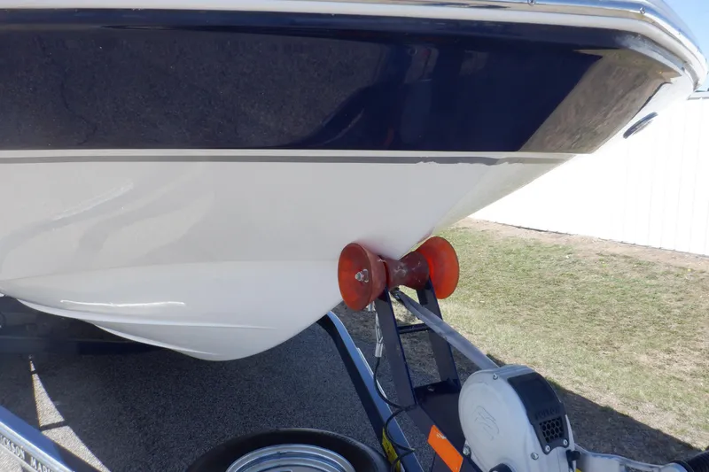 Slide: The Image of 2014 Hurricane SunDeck Sport 203 OB boat on trailer, close-up view of hull and bow. - 20