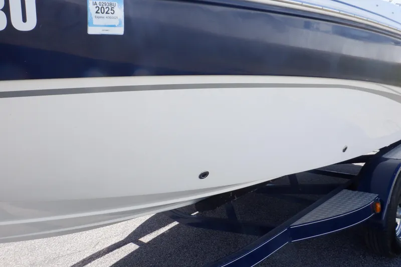 Slide: The Image of 2014 Hurricane SunDeck Sport 203 OB boat on trailer, side view. - 28
