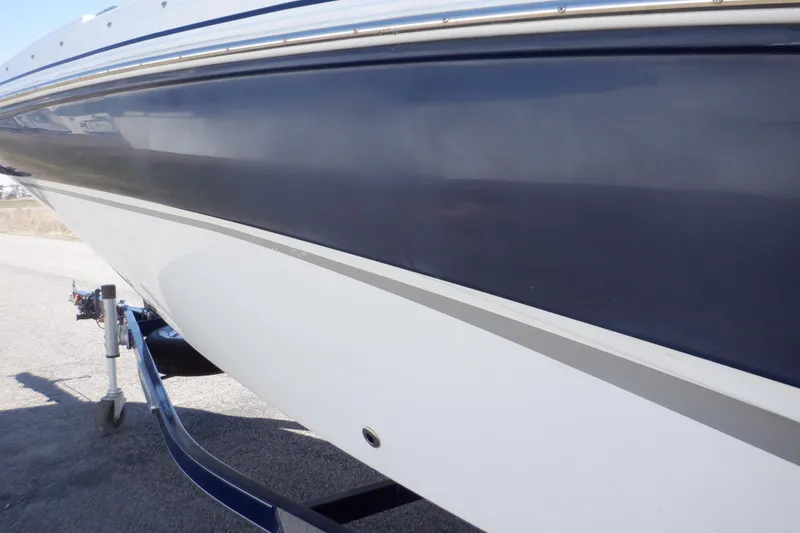 Slide: The Image of 2014 Hurricane SunDeck Sport 203 OB boat side view on trailer. - 30
