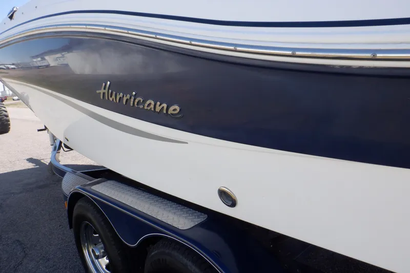 Slide: The Image of 2014 Hurricane SunDeck Sport 203 OB boat, blue and white exterior, on trailer. - 31