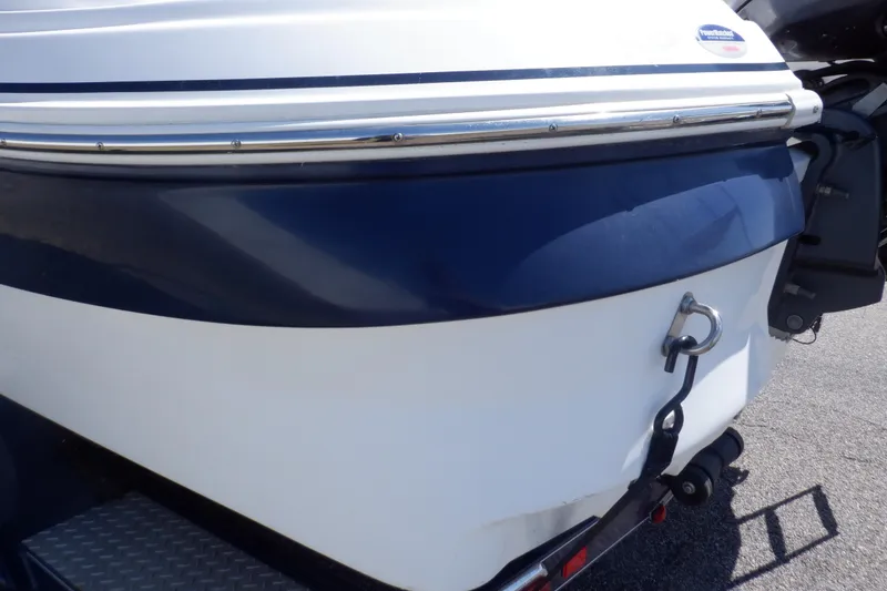 Slide: The Image of 2014 Hurricane SunDeck Sport 203 OB boat, blue and white hull, rear view. - 32