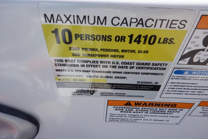 Slide: The Image of 2014 Hurricane SunDeck Sport 203 OB capacity label: 10 persons or 1410 lbs, 200 horsepower motor. - 35