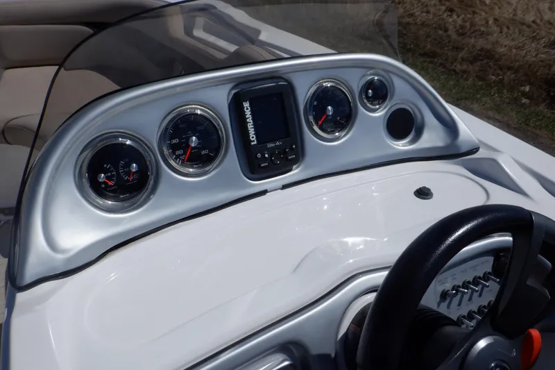 Slide: The Image of Dashboard of 2014 Hurricane SunDeck Sport 203 OB boat with gauges and steering wheel. - 36