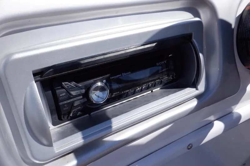 Slide: The Image of 2014 Hurricane SunDeck Sport 203 OB boat stereo system close-up. - 37