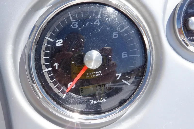 Slide: The Image of Close-up of a 2014 Hurricane SunDeck Sport 203 OB tachometer showing RPM. - 38
