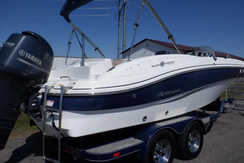 Slide: The Image of 2014 Hurricane SunDeck Sport 203 OB boat with Yamaha engine on trailer. - 4