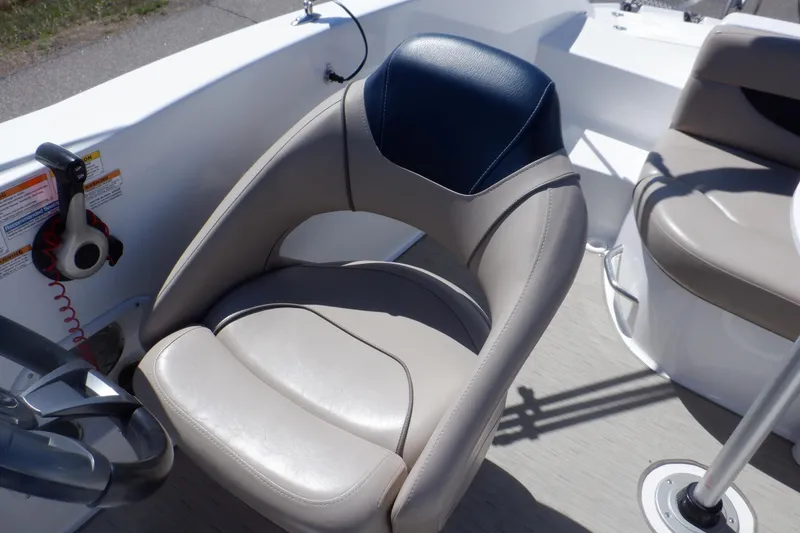 Slide: The Image of 2014 Hurricane SunDeck Sport 203 OB boat interior with comfortable seating and steering wheel. - 40
