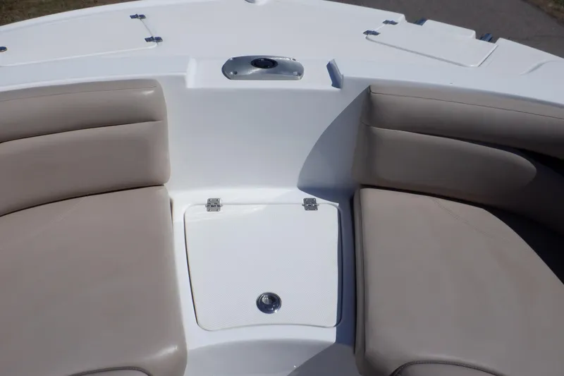Slide: The Image of 2014 Hurricane SunDeck Sport 203 OB boat interior with beige seating and storage compartment. - 46