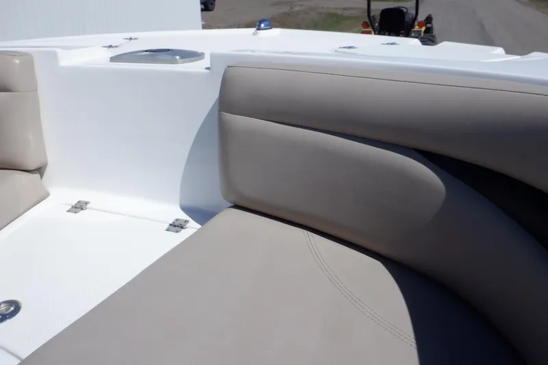 Slide: The Image of 2014 Hurricane SunDeck Sport 203 OB boat interior with beige seating and white deck. - 50