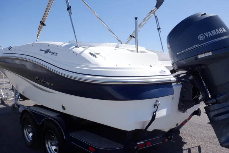 Slide: The Image of 2014 Hurricane SunDeck Sport 203 OB boat with Yamaha outboard motor on trailer. - 9