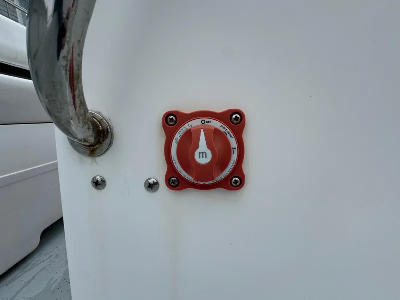 Slide: The Image of Red dial on Maritime 1690 boat, 2003 model, with metal handle nearby. - 11
