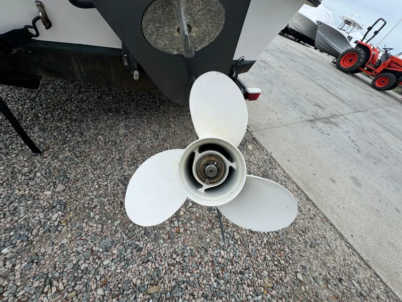 Slide: The Image of Boat propeller of a 2003 Maritime 1690 on gravel surface. - 17