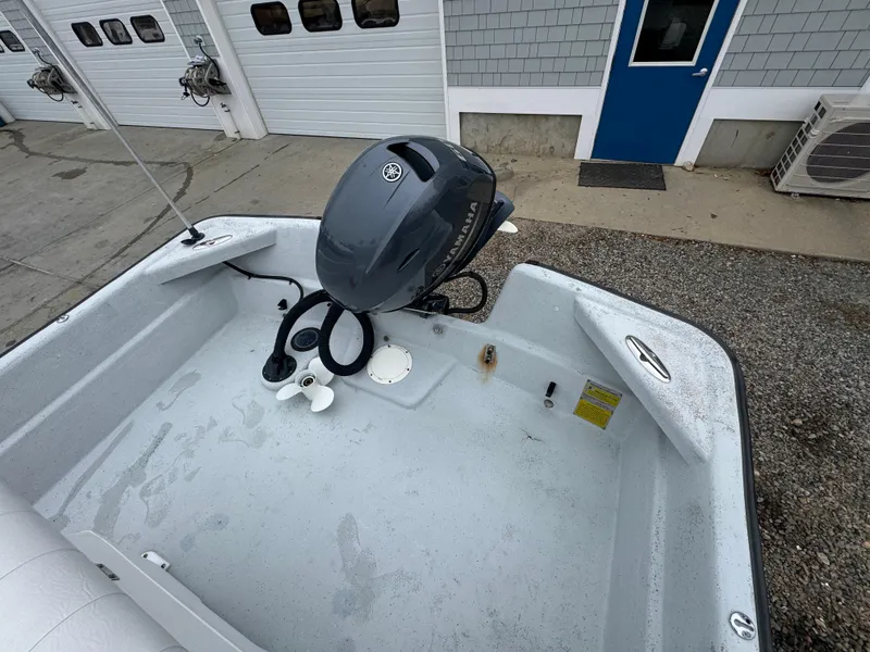 Slide: The Image of Boat interior with outboard motor, Maritime 1690 model, 2003, near garage doors. - 4