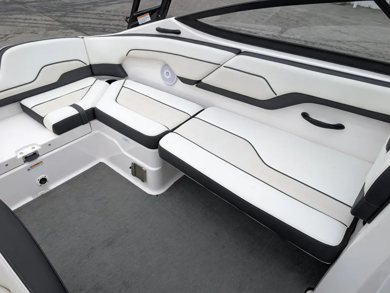 Slide: The Image of 2017 Yamaha Boats AR210 interior seating with white and black upholstery. - 16