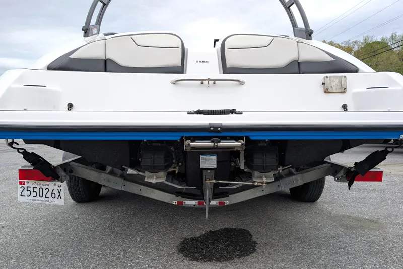 Slide: The Image of 2017 Yamaha AR210 boat rear view on trailer, showcasing dual engines and sleek design. - 4