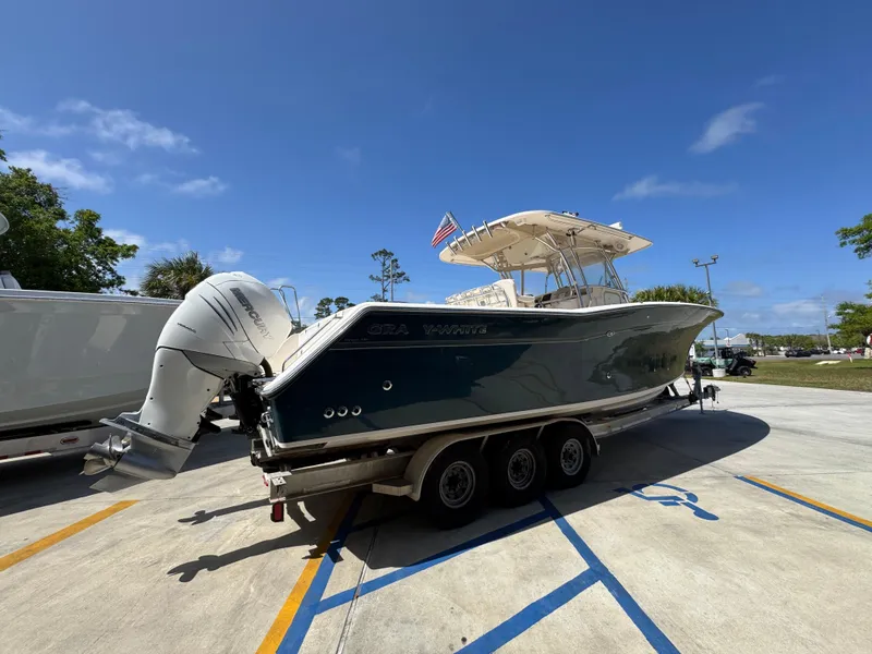 Slide: The Image of 2014 Grady-White Canyon 336 boat on trailer under clear blue sky. - 17