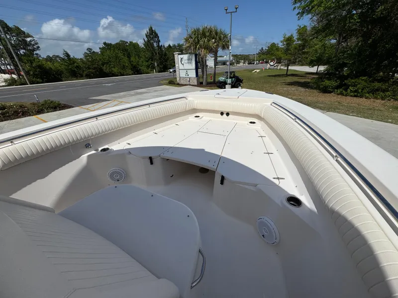 Slide: The Image of 2014 Grady-White Canyon 336 boat interior with seating and storage compartments. - 25