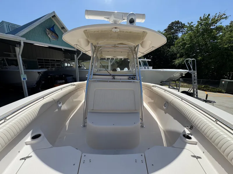 Slide: The Image of 2014 Grady-White Canyon 336 boat, spacious deck, center console, outdoor setting. - 29