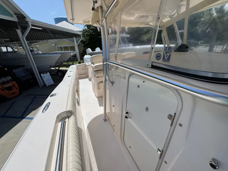 Slide: The Image of 2014 Grady-White Canyon 336 boat interior, showcasing seating and storage compartments. - 32