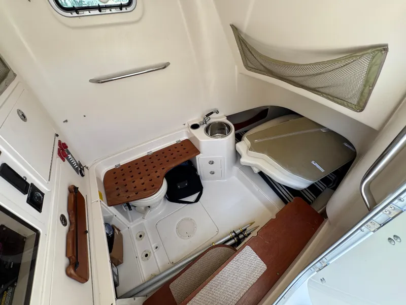 Slide: The Image of 2014 Grady-White Canyon 336 cabin interior with seating and storage. - 33