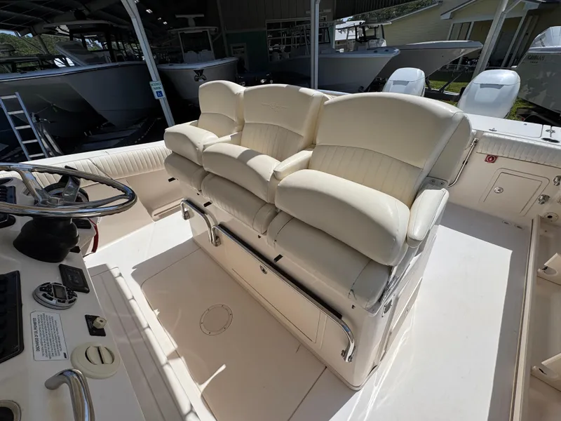 Slide: The Image of 2014 Grady-White Canyon 336 boat interior with cream leather seating. - 36