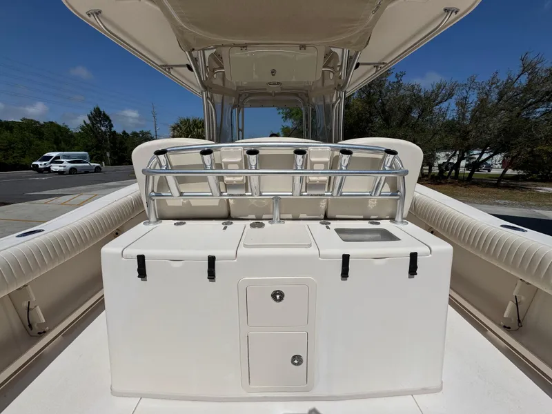 Slide: The Image of 2014 Grady-White Canyon 336 boat interior with rod holders and storage compartments. - 44