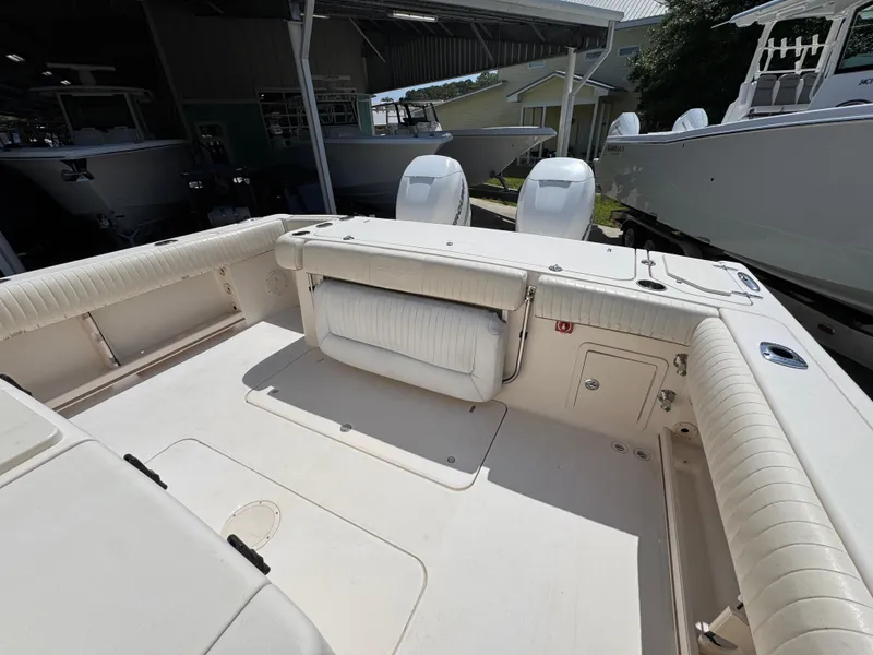 Slide: The Image of 2014 Grady-White Canyon 336 boat interior with seating and storage compartments. - 46