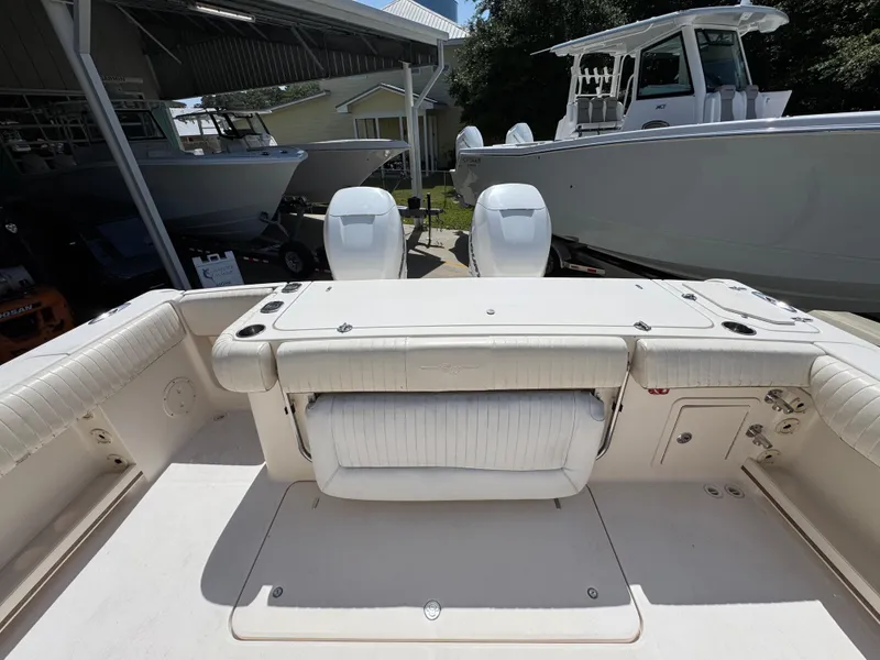 Slide: The Image of 2014 Grady-White Canyon 336 boat interior with seating and storage compartments. - 47