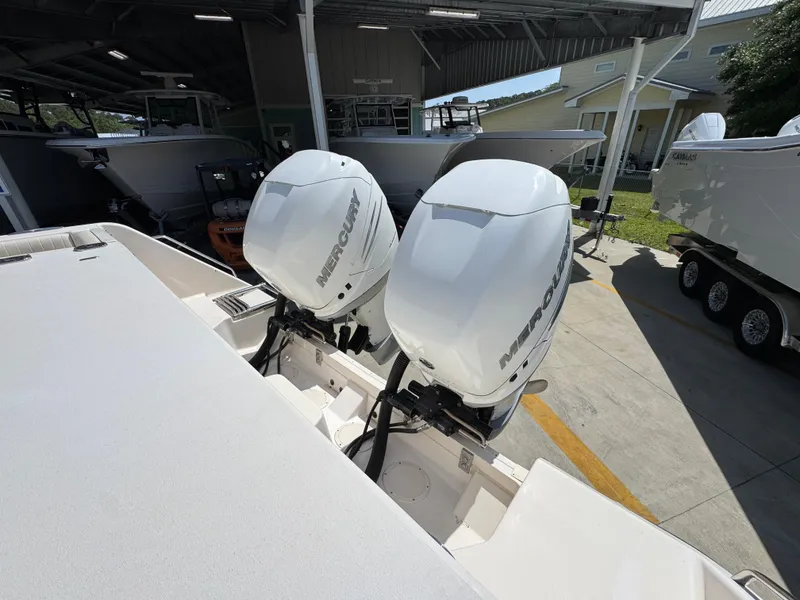 Slide: The Image of 2014 Grady-White Canyon 336 with twin Mercury outboard engines in a boatyard. - 48