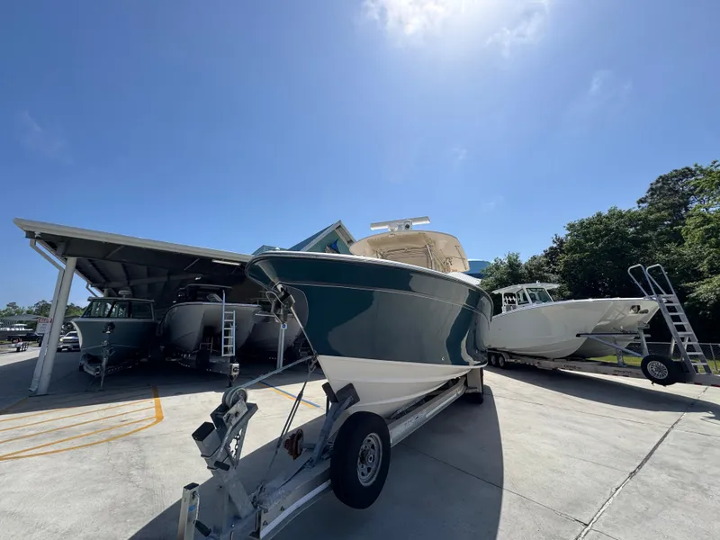 Slide: The Image of 2014 Grady-White Canyon 336 boat on trailer under clear blue sky. - 7