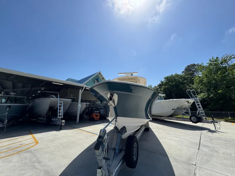 Slide: The Image of 2014 Grady-White Canyon 336 boat on trailer under clear blue sky. - 8