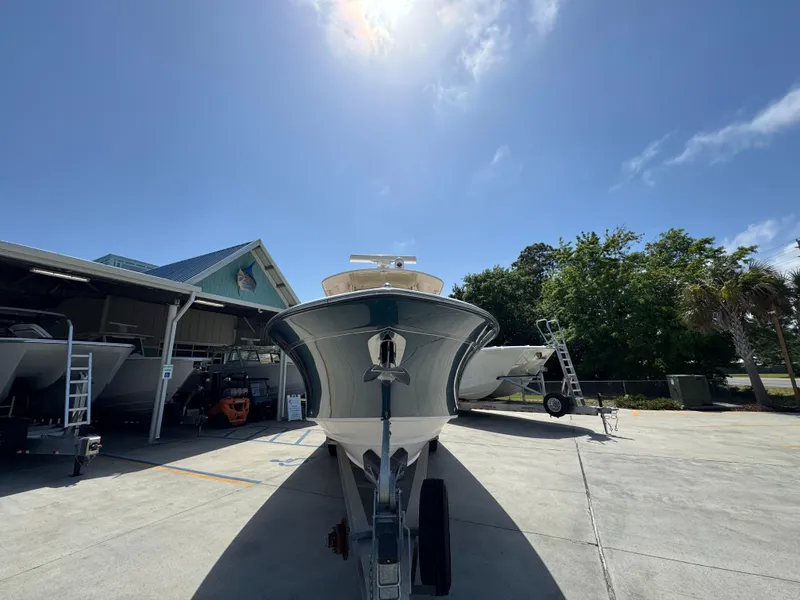 Slide: The Image of 2014 Grady-White Canyon 336 boat on trailer under clear blue sky. - 9