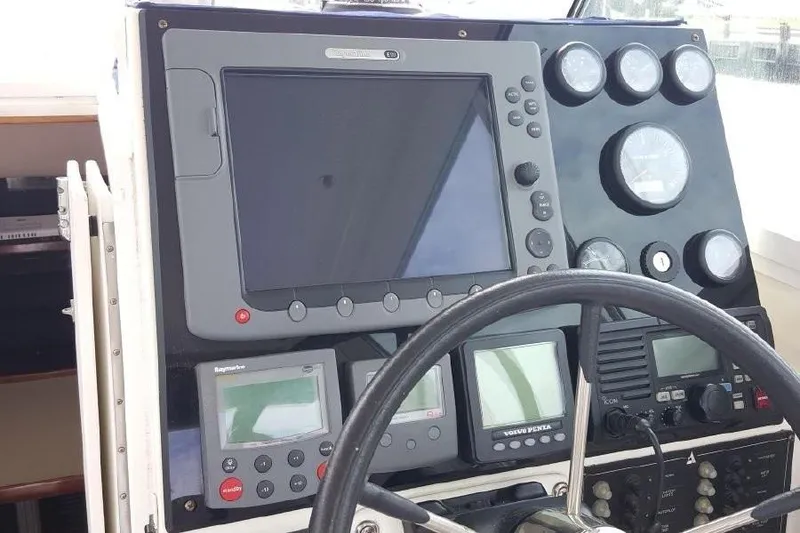 Slide: The Image of Control panel of a 2007 Albin 28 Tournament Express boat with navigation instruments. - 12