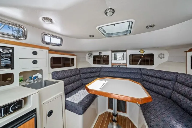 Slide: The Image of Interior of 2007 Albin 28 Tournament Express boat with seating and kitchenette. - 17