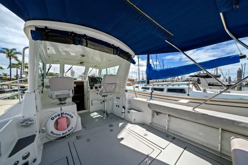 Slide: The Image of 2007 Albin 28 Tournament Express boat interior with blue canopy at marina. - 6